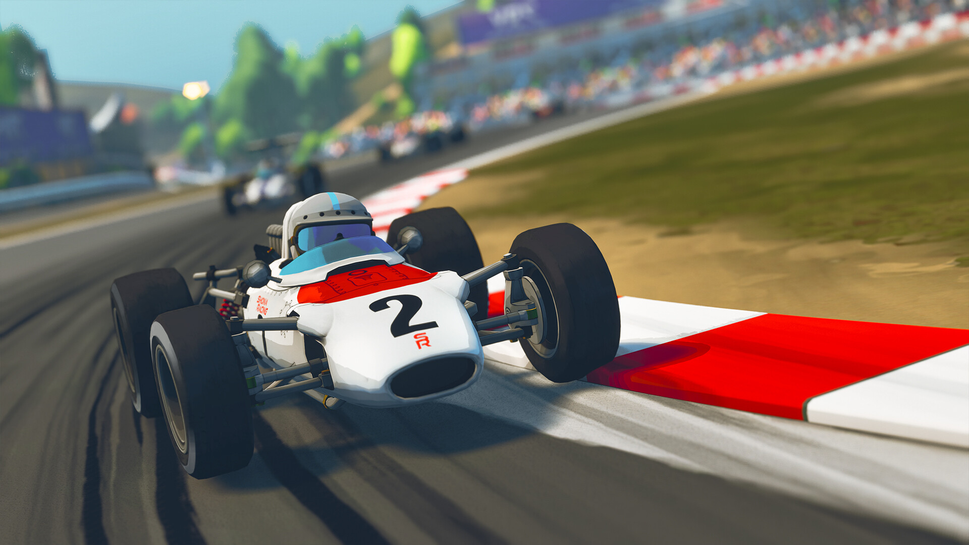 Formula Legends classic-era open-wheel car cornering on a historic circuit
