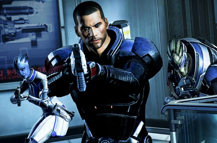 Mass Effect key art — Commander Shepard aiming a pistol with Liara T'Soni and Garrus Vakarian